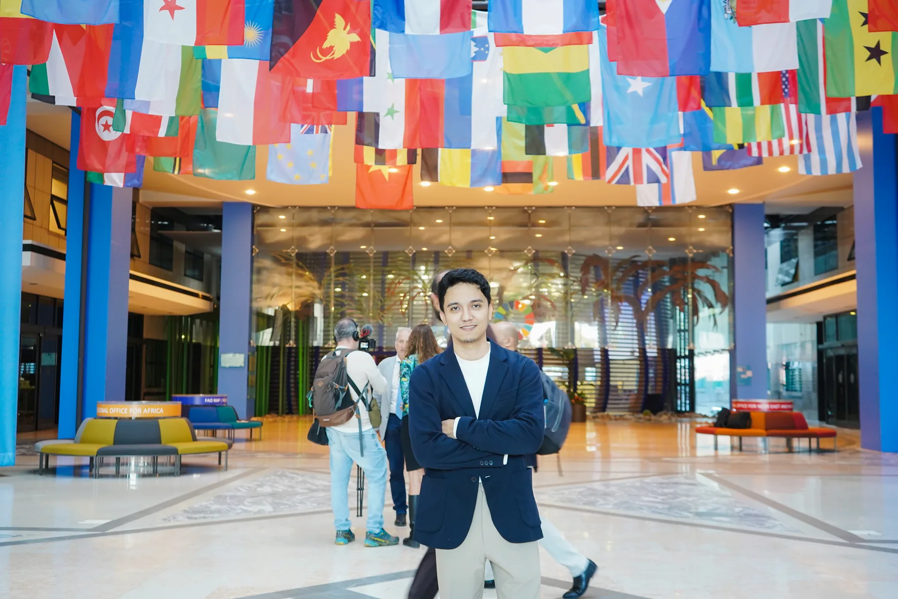 Alvin Baloloy at FAO Headquarters beneath international flags