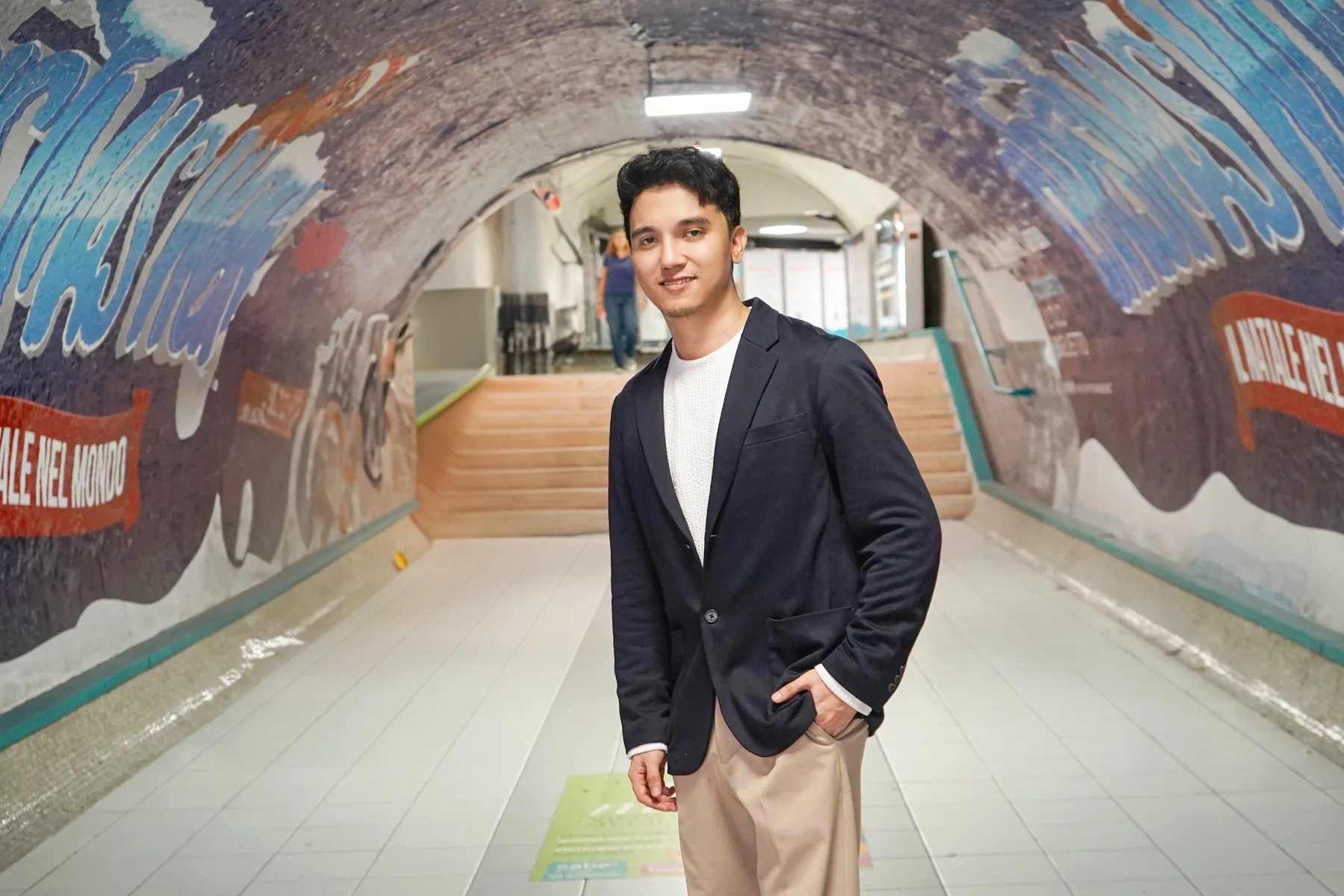 Alvin Baloloy inside a colorful passageway in Rome